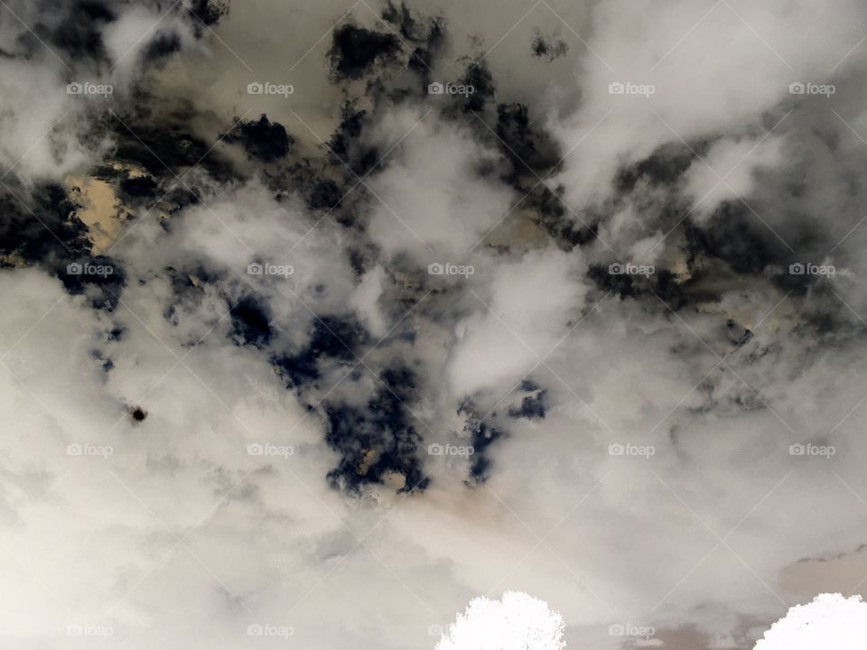 Someone blew up the marshmallow man,Poof! Stormy sky in black and white!  Cotton candy.