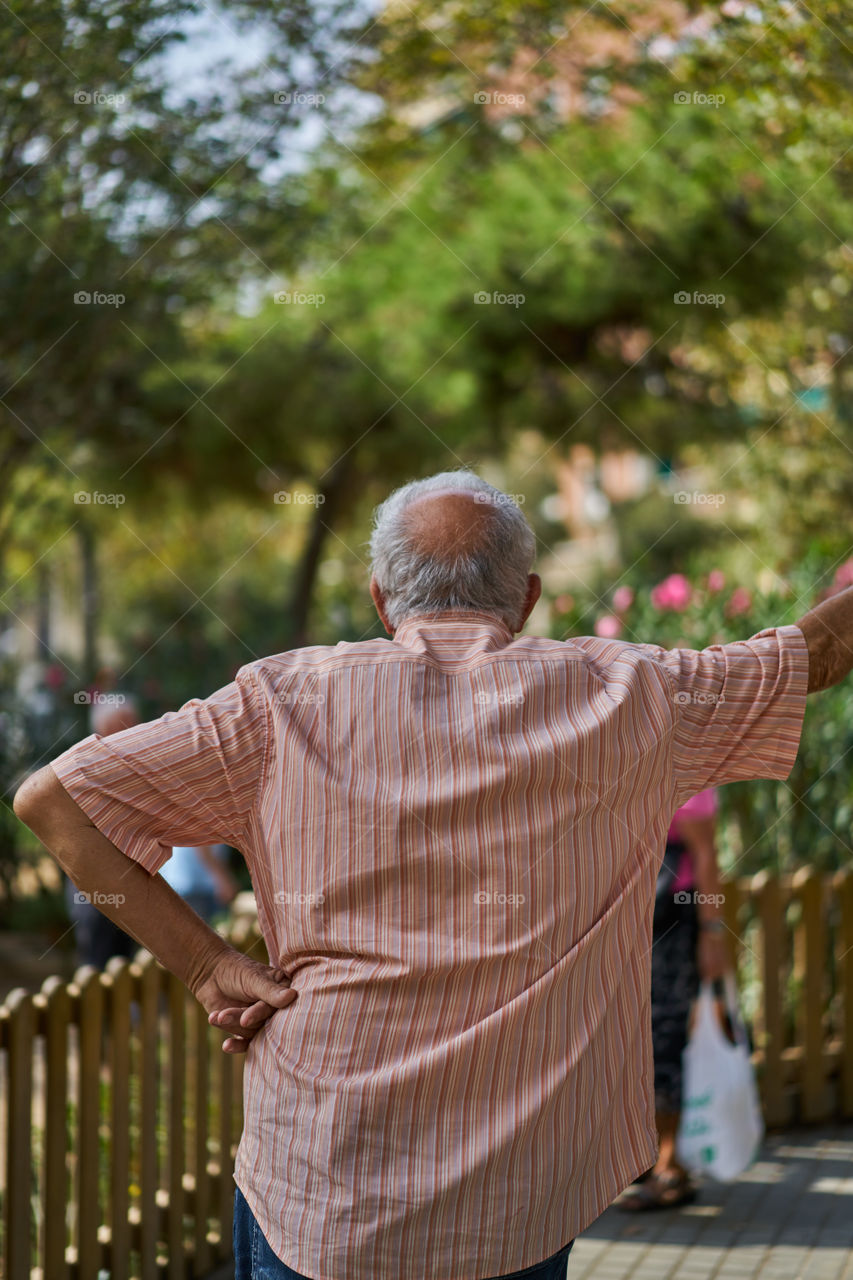 Elderly man looking at