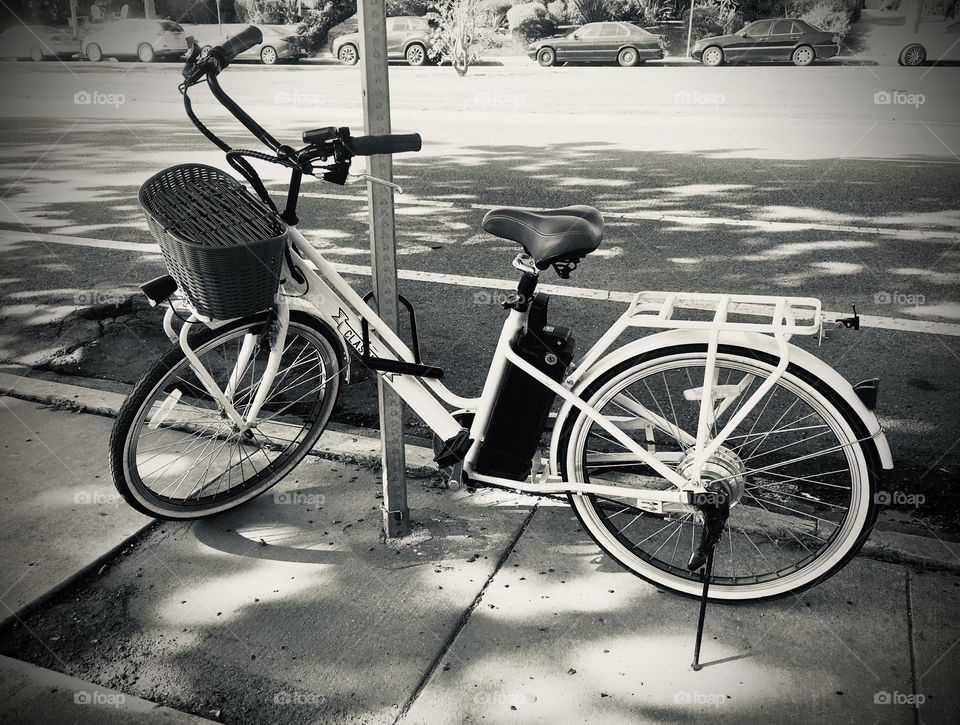 Bicycle, outdoor, outdoors, outside, street, sidewalk, black and white, parked, bike, vintage, leisure, bike lock, city, parked cars, daylight, daytime, no person