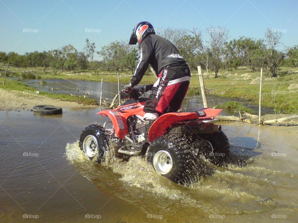 Liv'in it. Quad bike in water