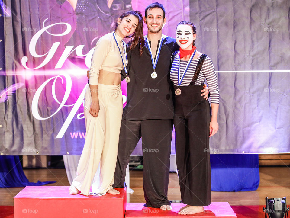 Young Happy People Winning Medal Awards
