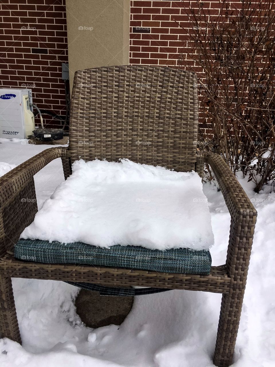 Bed of snow on an arm chair