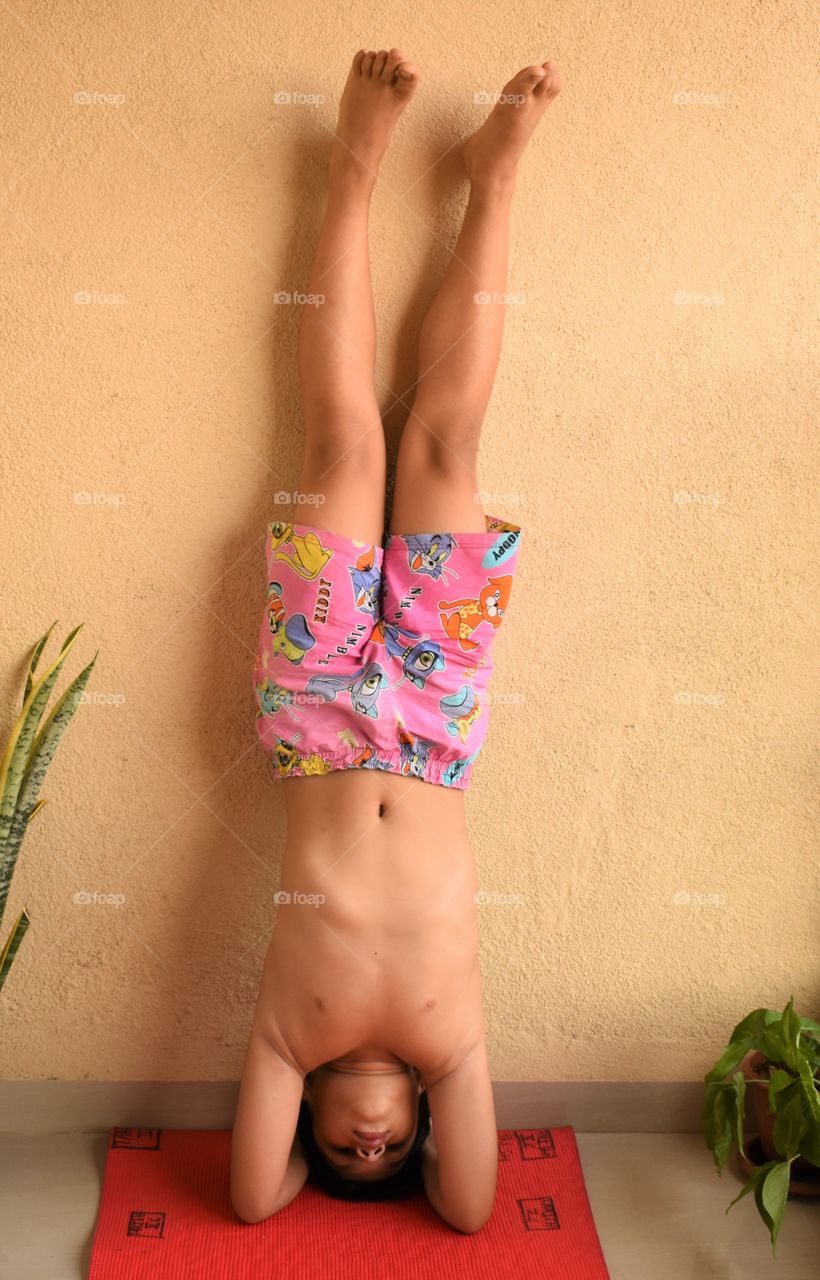 my 9 years old baby doing headstand with wall support 🤸....a moment to freeze...😘