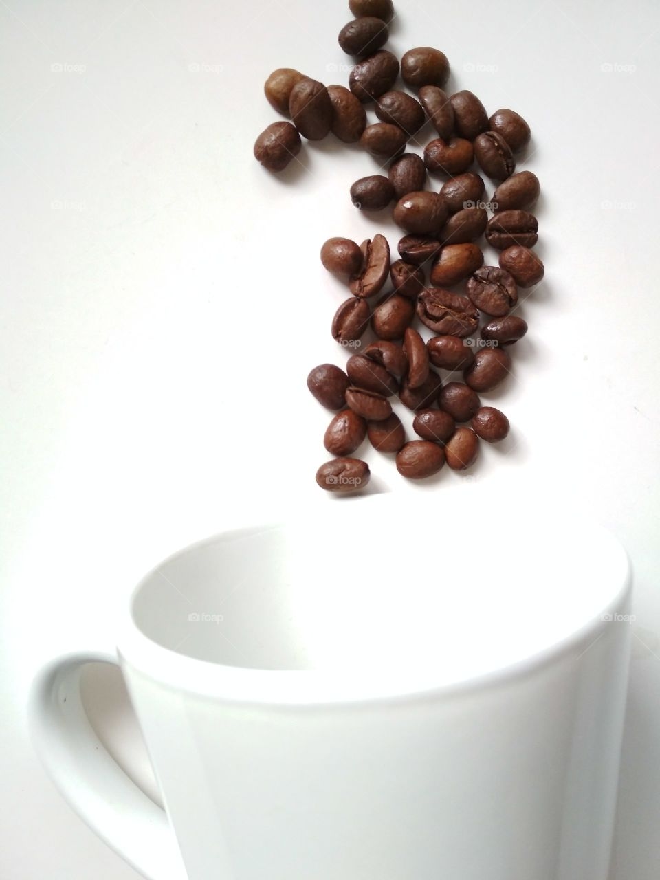Coffee beans and cup