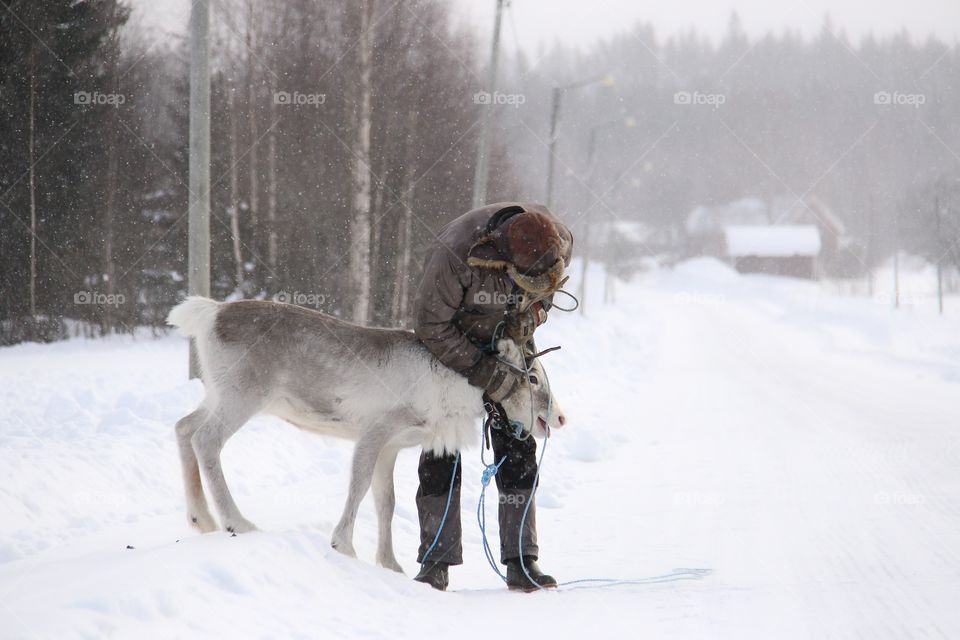 old man with reindeer