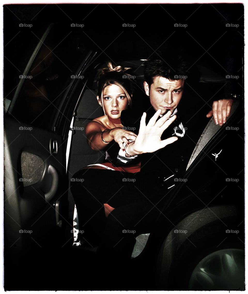 Couple getting out of car 