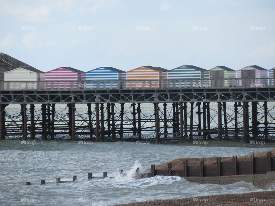 Beach huts on pier at Hastings