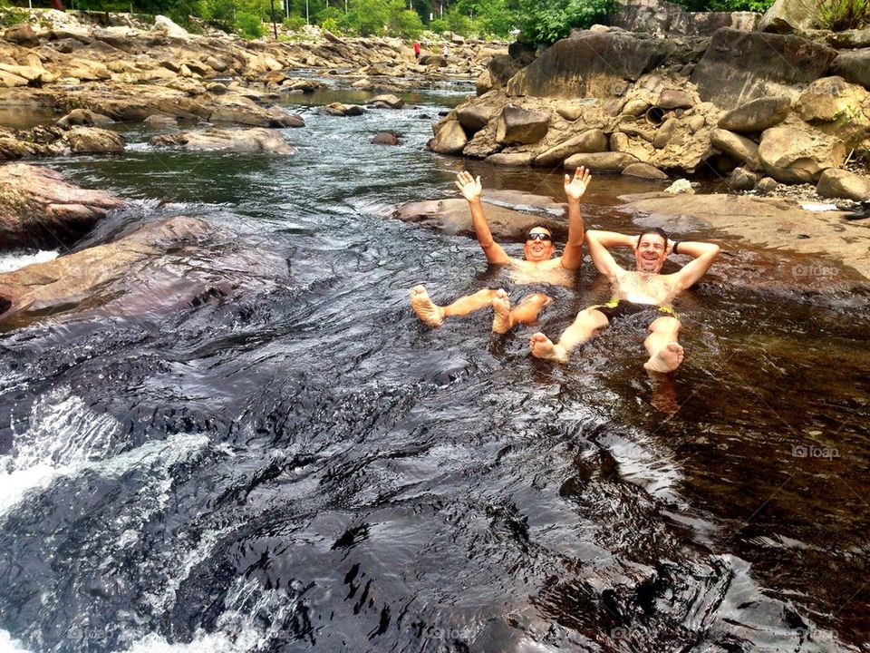 Two men enjoying in a river