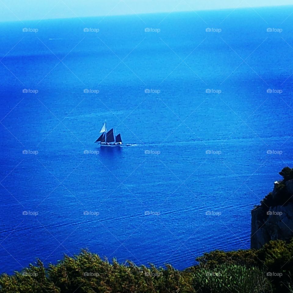 Boat in the deep blue 
Alghero, Sardinia, Italy
