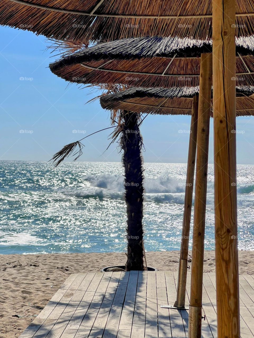 Thatch umbrella by the ocean