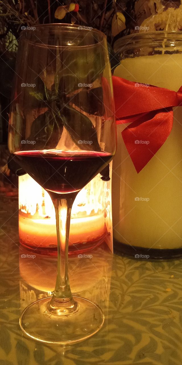 Glas of wine by the candlel