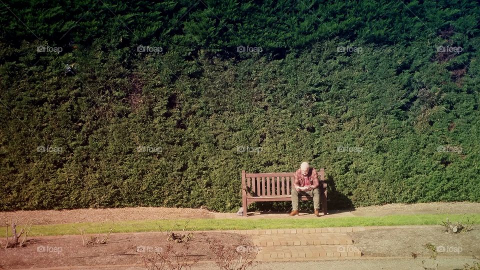 man sitting on his own