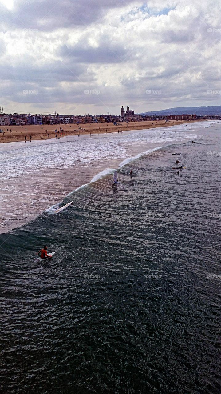 Waiting  for a wave!. Waiting for the perfect wave under a cloudy sky!