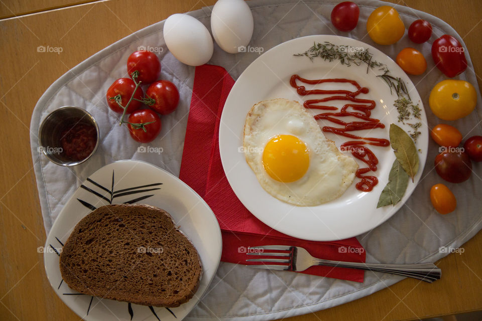 Eggs, tomatoes and bread in a pretty little spread