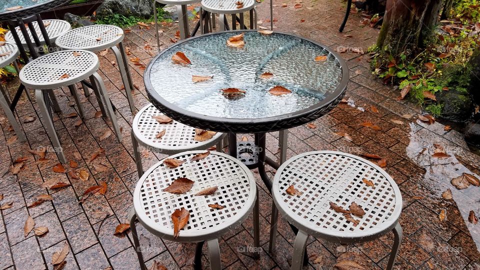 Wet tables and fallen leaves