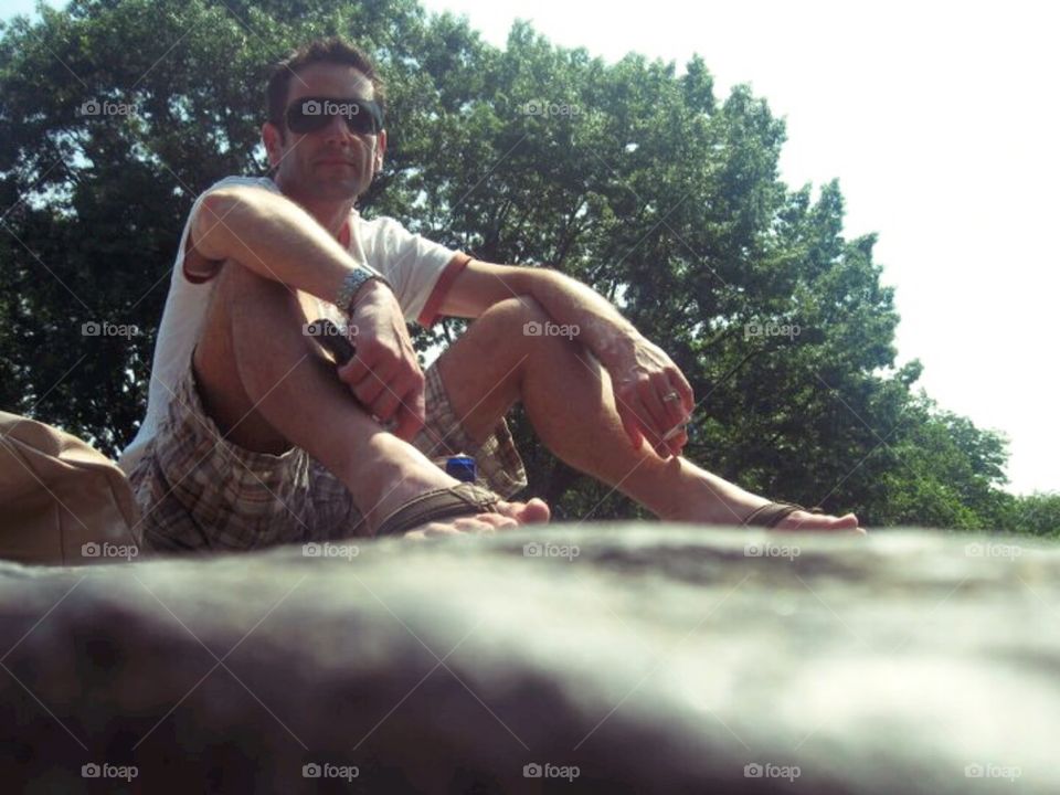 Sitting on a rock in Central Park NYC