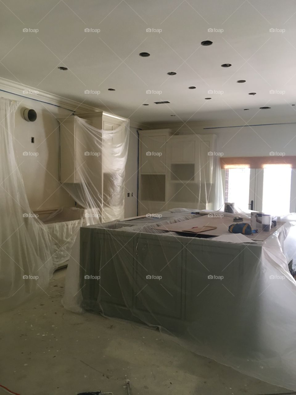 Another picture of the kitchen different angle coveed up with plastic wrap for protection 