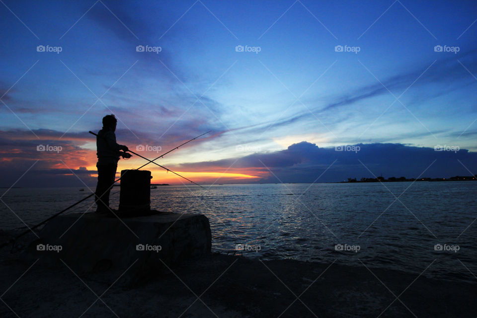 Fishing in sunset time