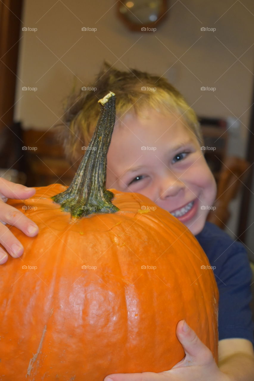 A boy with a pumpkin 