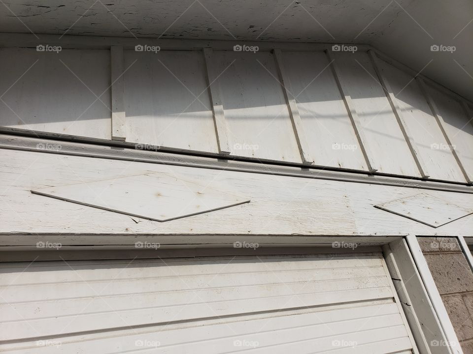 architectural detail on old garage above doors