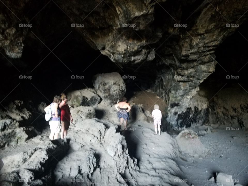 family explores Makua Cave