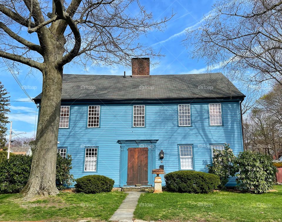 New England colonial style blue house in the historic district of town… 