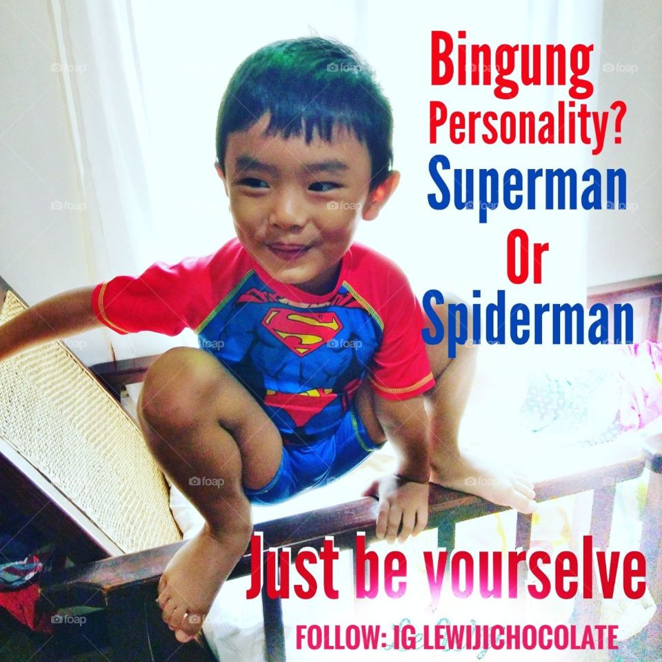 child confused want to be superman or spiderman