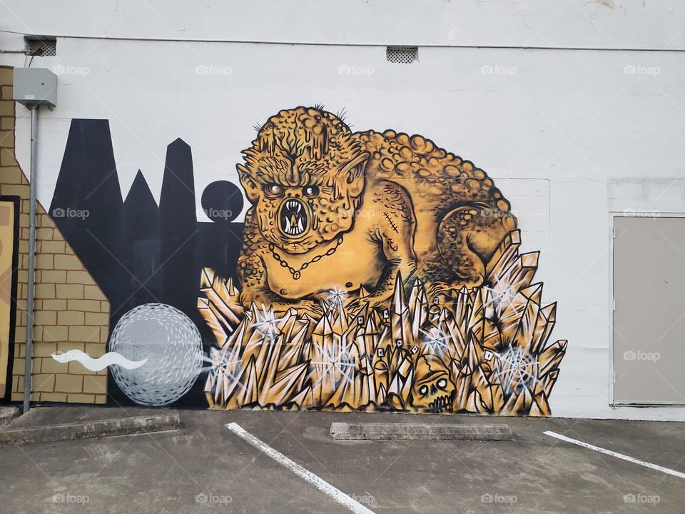 Orange creature on the wall