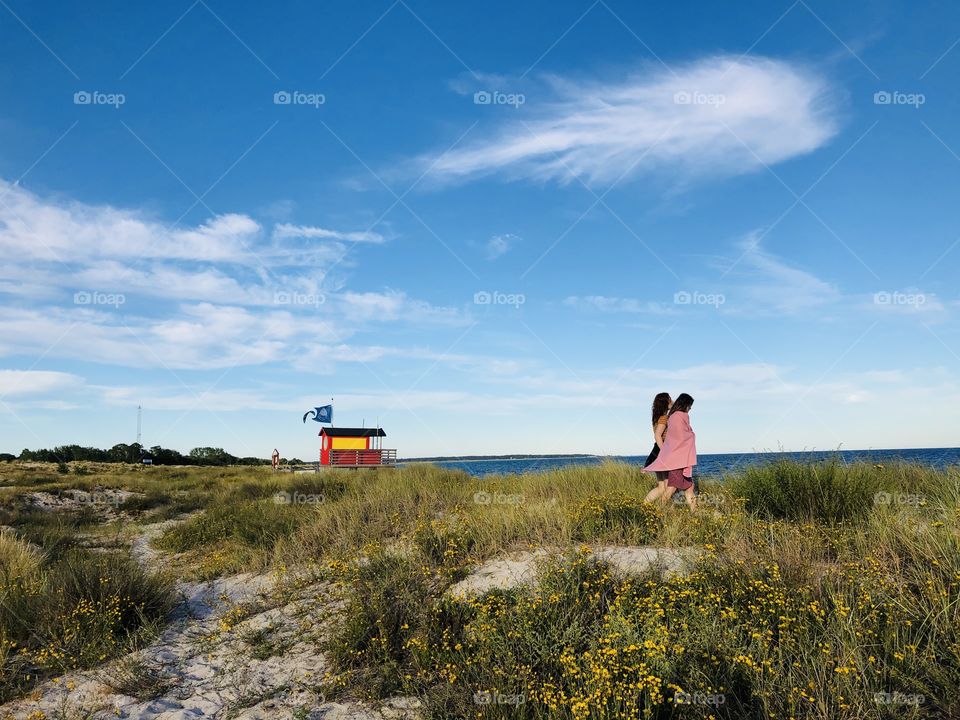 Friends at the beach summer evening