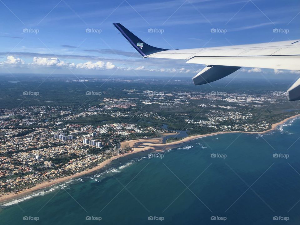 view from the airplane window to the beach