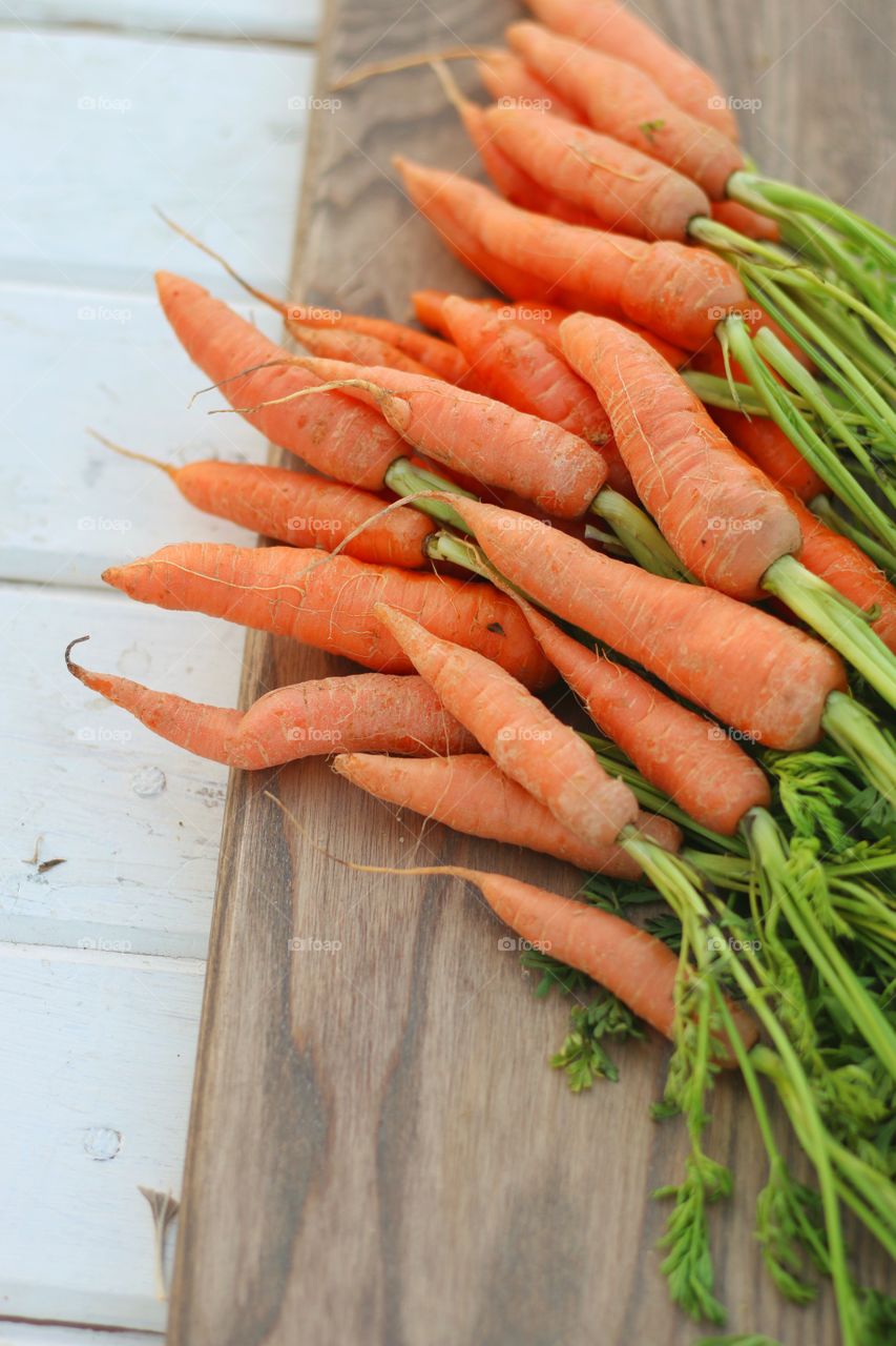 Overhead view of carrots on wood