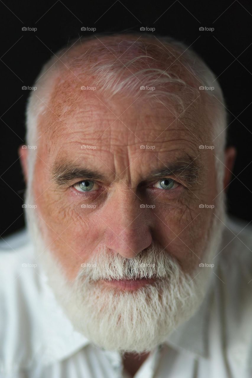 Portrait of an adult, emotions, wrinkles and the history of a person’s life in one portrait. Unique face skin stories