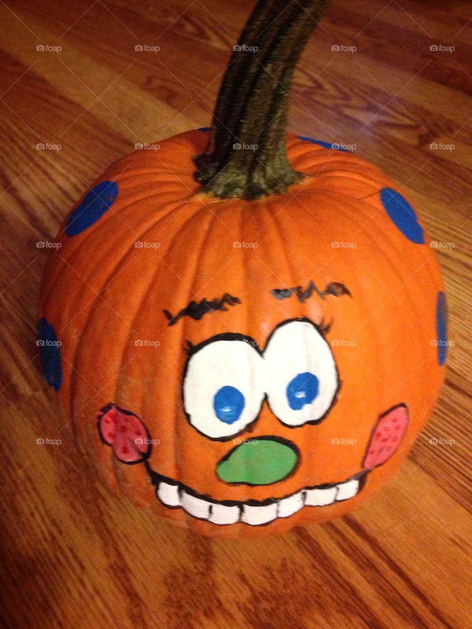 Painted pumpkin jack-o’-lantern for Halloween