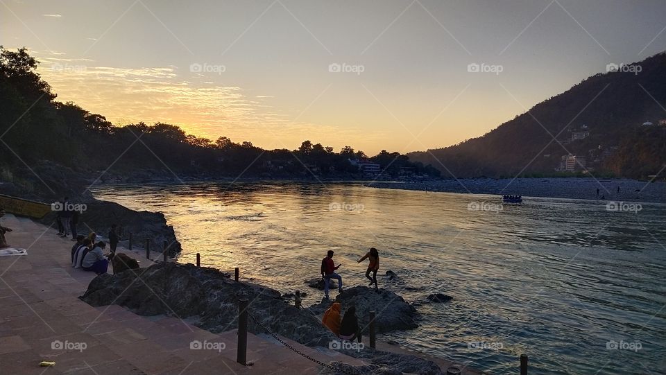 river sunset people water sky