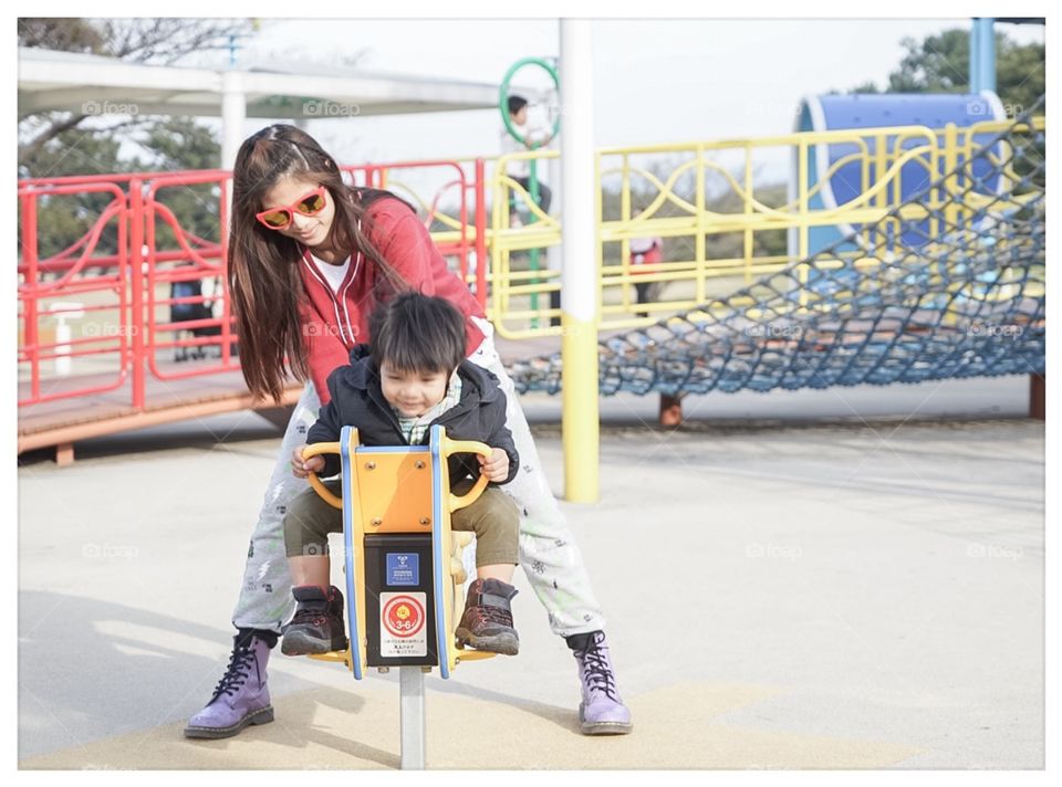 Mother and child in playground 