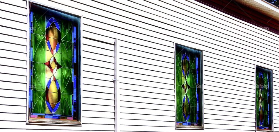 Beautiful and very old stained glass windows on an old church on the backroads of Mississippi.