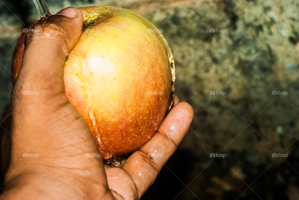 Person cleaning apple