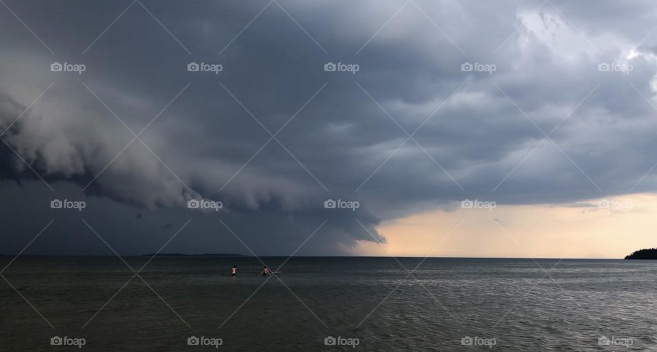 Summer storm approaching the swimmers