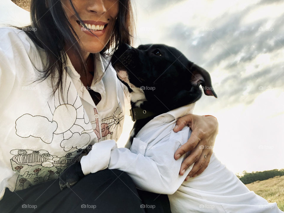 Beautiful girl smiling with her pet