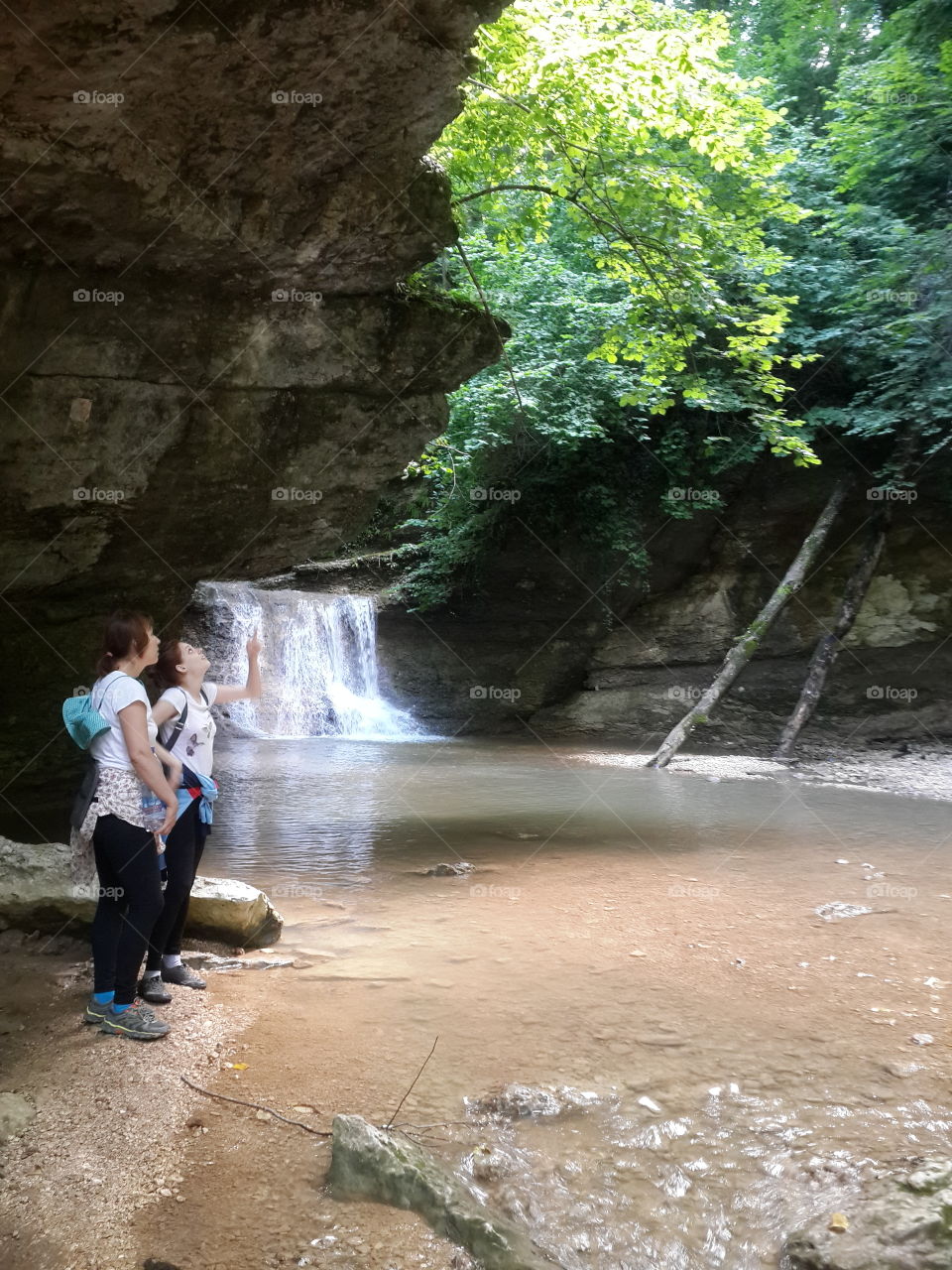 Hihking. Waterfall in gorge