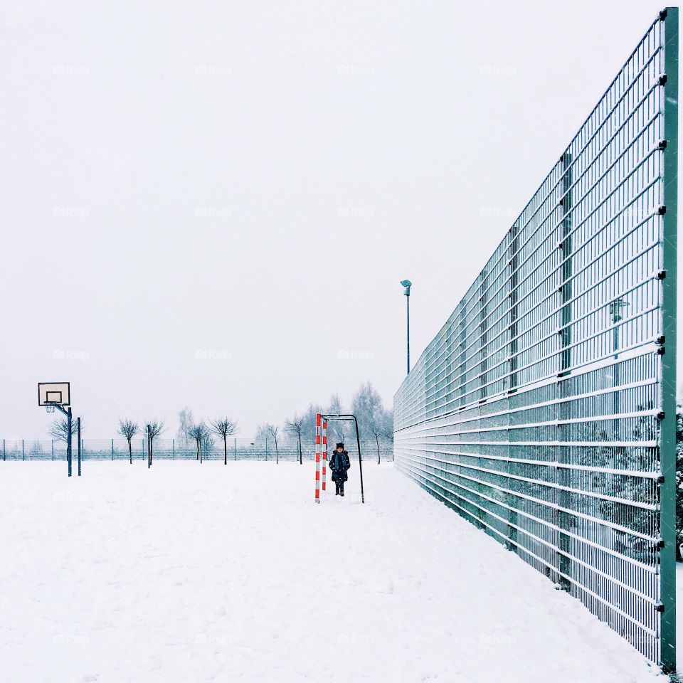 Girl standing on snowy landscape