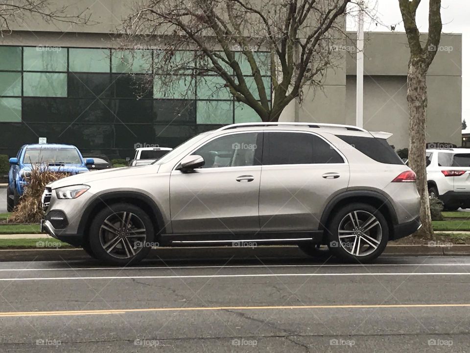 An SUV parked in front of the church on Sunday morning.