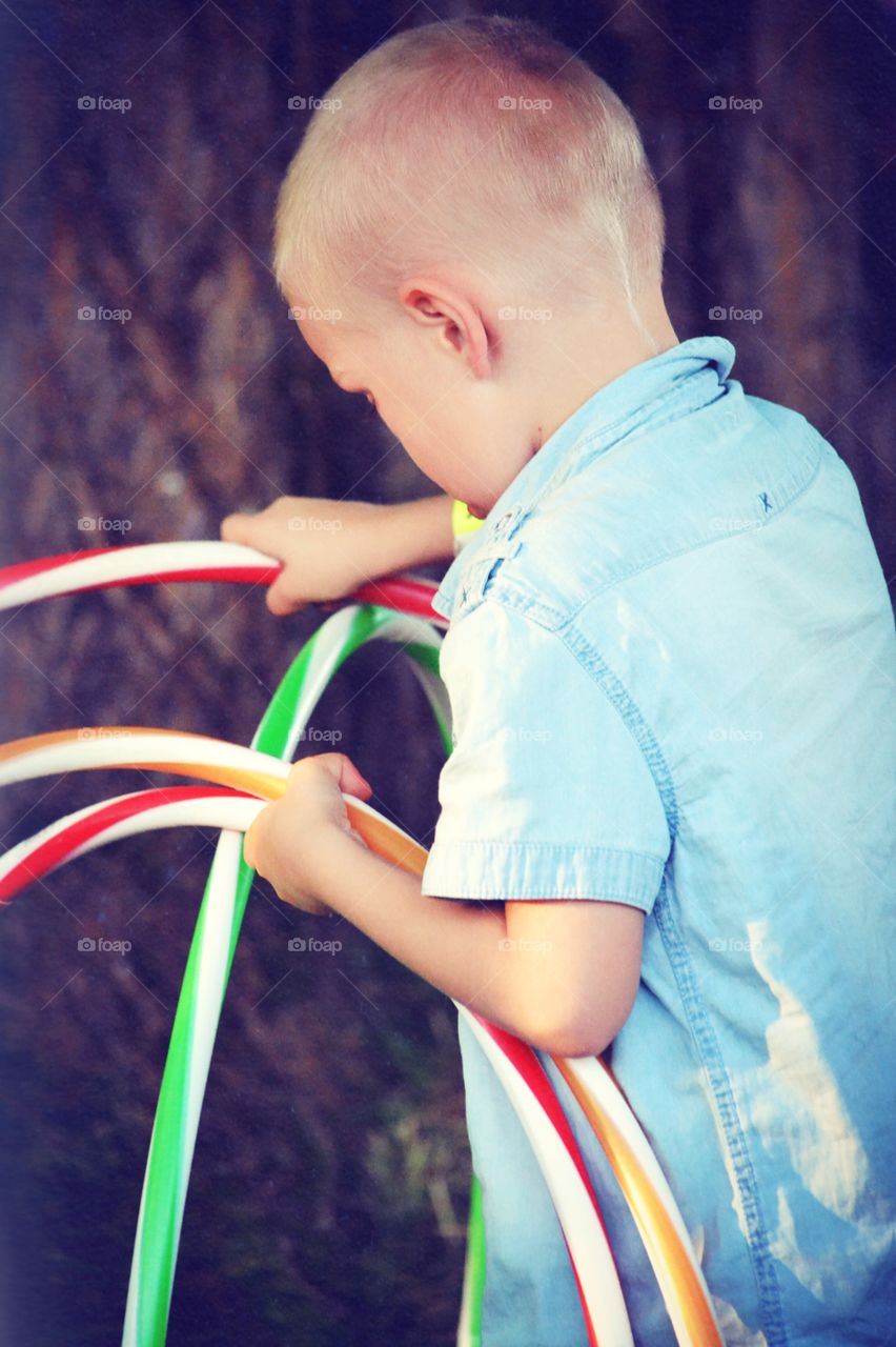 Boy with hula hoops