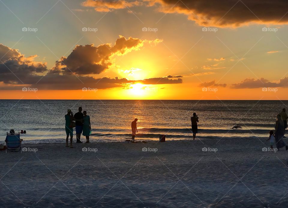 Summertime sunsets on the beach.