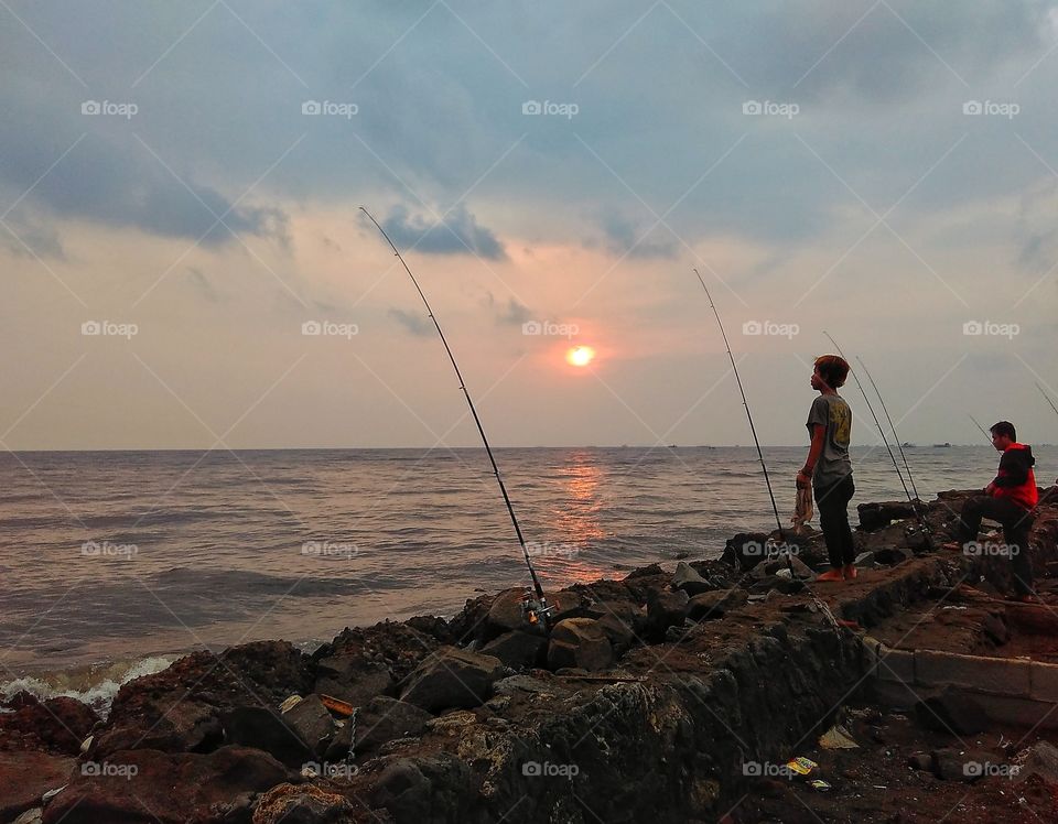 girl fishing on the beach