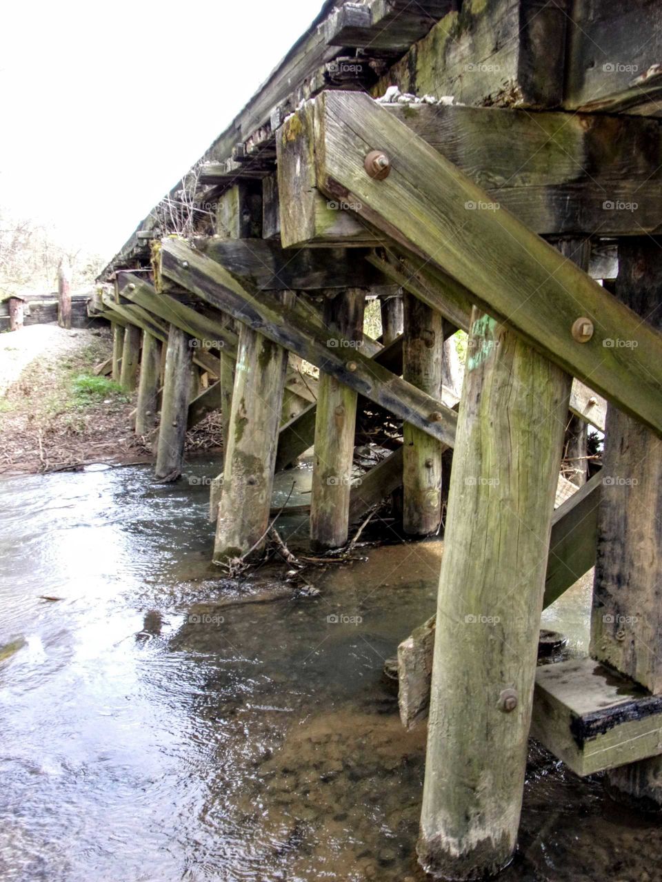 Creek running under abandoned railroad tracks