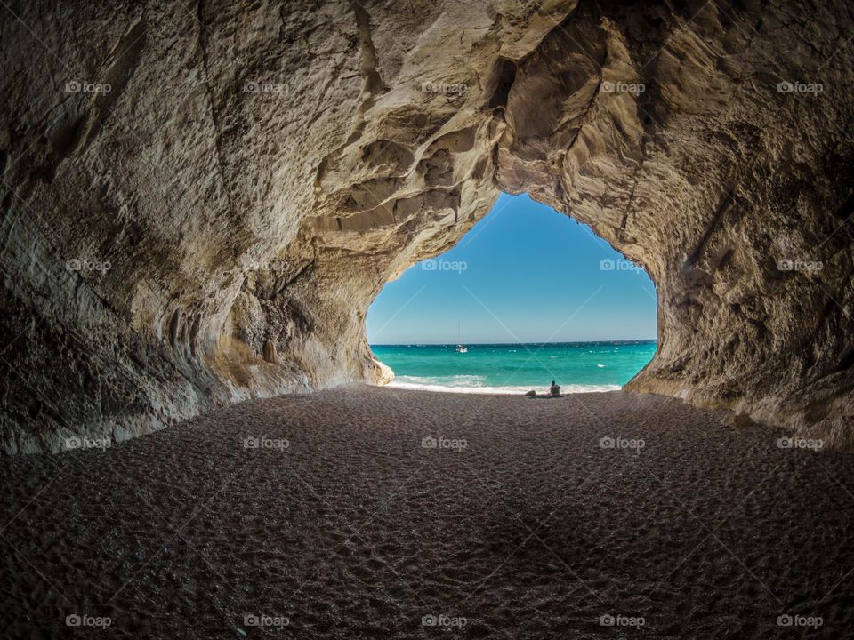 Brown Tunnel Near Body of Water