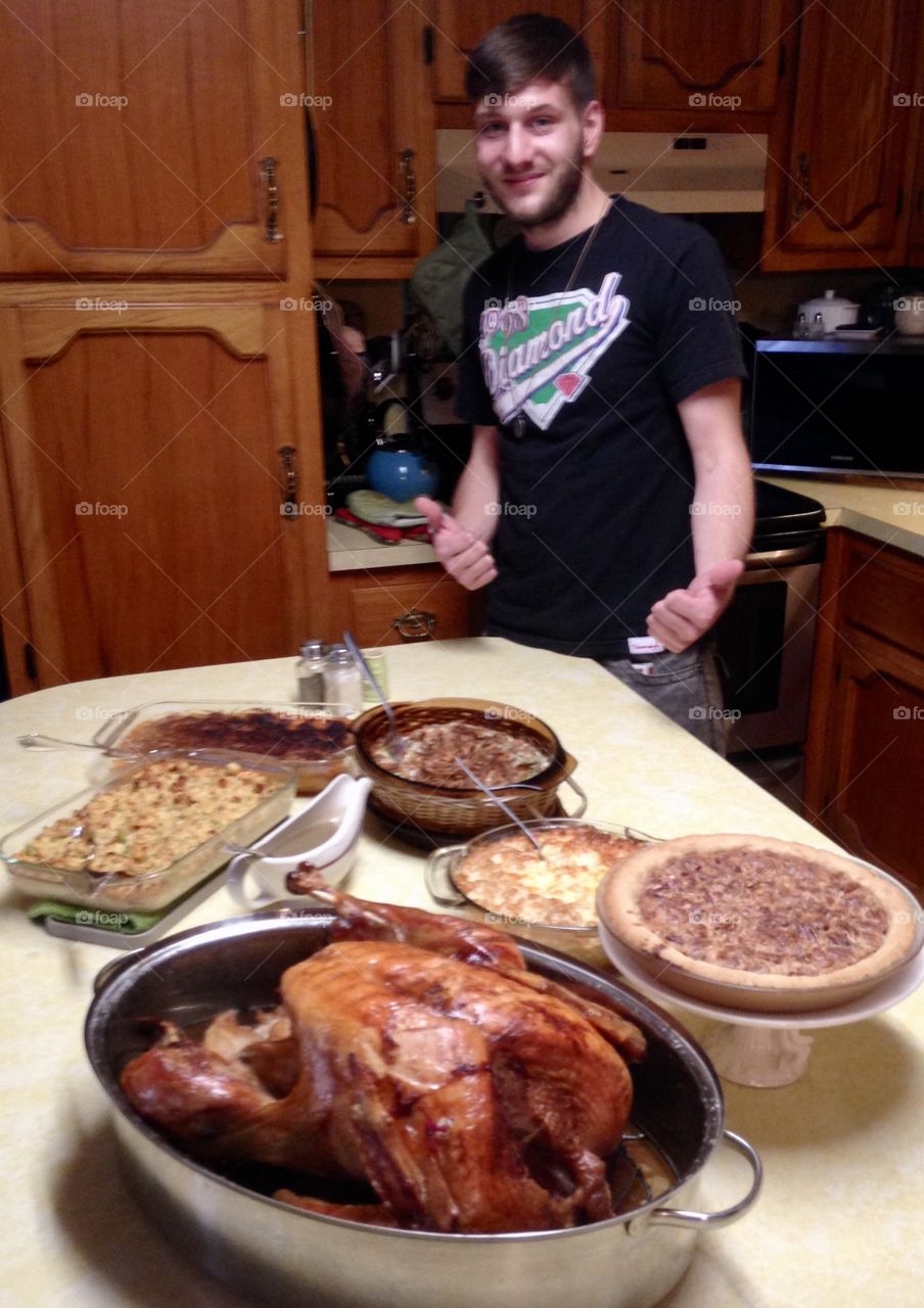 Young man enjoying Thanksgiving dinner