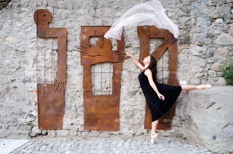 Young Female Ballerina Dancing with a Scarf Outside