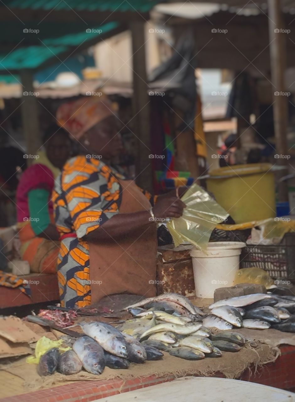 Fish seller at Ngor market.